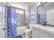 Modern bathroom with new fixtures, tiled shower and new vanity at 427 Mindoro Ave, North Las Vegas, NV 89031