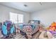 Cozy bedroom with laminate floors, natural light, and a comfortable bed and decor at 427 Mindoro Ave, North Las Vegas, NV 89031
