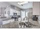 Modern kitchen with white cabinets, granite countertops, and stainless steel appliances at 427 Mindoro Ave, North Las Vegas, NV 89031