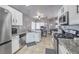 Bright kitchen with stainless steel appliances, granite countertops and tile flooring at 427 Mindoro Ave, North Las Vegas, NV 89031