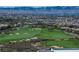 Lush green golf course surrounded by desert landscape and mountain views at 438 Serenity Point Dr, Henderson, NV 89012