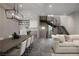 Open concept living room and kitchen with modern staircase at 438 Serenity Point Dr, Henderson, NV 89012