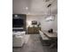 Elegant living room and dining area with modern furnishings and fireplace at 438 Serenity Point Dr, Henderson, NV 89012