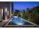Backyard pool with water features and landscaping offers a tranquil outdoor retreat with modern design at 438 Serenity Point Dr, Henderson, NV 89012
