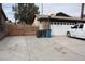 Large driveway leading to a two car garage with a basketball hoop above it at 4536 E Baltimore Ave, Las Vegas, NV 89104