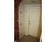 Hallway featuring tile flooring, a door to the outside and lots of built in storage at 4536 E Baltimore Ave, Las Vegas, NV 89104