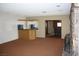 Open living room with a dry bar, fireplace and views to another room of the house at 4536 E Baltimore Ave, Las Vegas, NV 89104