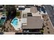 Aerial view of a backyard featuring a lagoon pool, covered patio, solar panels and RV parking at 4690 Designer Way, Las Vegas, NV 89129
