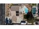 Aerial view of a backyard featuring a kidney-shaped pool, solar panels, and RV parking at 4690 Designer Way, Las Vegas, NV 89129