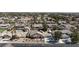 Aerial view of a single-Gathering home with a desert landscape, multiple car garage, and in-ground pool at 4690 Designer Way, Las Vegas, NV 89129