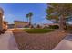 Expansive backyard featuring lush turf, desert landscaping, mature trees, and a sparkling pool at 4690 Designer Way, Las Vegas, NV 89129