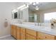 Bathroom showcasing a double sink vanity with tile countertop and neutral paint at 4690 Designer Way, Las Vegas, NV 89129