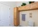 Bright bathroom featuring wooden cabinets above toilet, complementing the white fixtures and neutral walls at 4690 Designer Way, Las Vegas, NV 89129