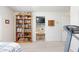 Bedroom featuring bookshelf, a desk, and a treadmill, combining relaxation and fitness at 4690 Designer Way, Las Vegas, NV 89129