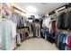 Walk-in closet with custom shelving and ample storage for clothes and accessories at 4690 Designer Way, Las Vegas, NV 89129