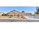 Charming single-story stucco home with desert landscaping and a three-car garage at 4690 Designer Way, Las Vegas, NV 89129