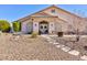 Inviting front entrance with stone pathway and charming facade at 4690 Designer Way, Las Vegas, NV 89129