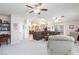 Spacious living room shows open floorplan, vaulted ceiling, and view into the kitchen at 4690 Designer Way, Las Vegas, NV 89129