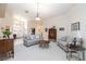 Spacious living room offering comfortable seating, neutral decor, and an open layout at 4690 Designer Way, Las Vegas, NV 89129