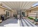 Relaxing covered patio featuring a built-in grill and ample seating for outdoor entertaining at 4690 Designer Way, Las Vegas, NV 89129
