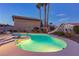 Relaxing backyard featuring a pristine pool, in ground spa, and desert landscaping at 4690 Designer Way, Las Vegas, NV 89129