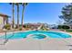 Stunning pool and spa combination with waterslide and mature landscaping at 4690 Designer Way, Las Vegas, NV 89129