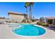 Inviting pool and spa combo with a waterslide and well-maintained landscaping at 4690 Designer Way, Las Vegas, NV 89129