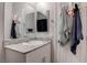 Bathroom vanity with granite countertop, modern faucet, and towels hung nearby, adding a touch of elegance at 4705 Blaise Ave # 101, North Las Vegas, NV 89084