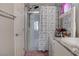 The bathroom boasts a walk-in shower, granite countertops, and ample counter space at 4705 Blaise Ave # 101, North Las Vegas, NV 89084