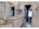 Well-lit bathroom featuring a double sink vanity with granite countertops and modern fixtures at 4705 Blaise Ave # 101, North Las Vegas, NV 89084