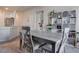 Charming dining area with wooden table set, adjacent to a kitchen and living space at 4705 Blaise Ave # 101, North Las Vegas, NV 89084