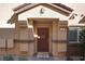 Inviting front door with decorative accents, textured walls, and a well-maintained entryway at 4705 Blaise Ave # 101, North Las Vegas, NV 89084