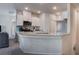 Modern kitchen featuring granite countertops, stainless steel appliances, and ample cabinet space at 4705 Blaise Ave # 101, North Las Vegas, NV 89084