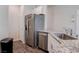 Stainless steel appliances, granite countertops, and modern cabinetry at 4705 Blaise Ave # 101, North Las Vegas, NV 89084