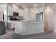 Open-concept kitchen featuring granite countertops and views into the adjacent living area at 4705 Blaise Ave # 101, North Las Vegas, NV 89084