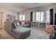 Bright living room featuring a comfortable sectional sofa, large window, and stylish decor at 4705 Blaise Ave # 101, North Las Vegas, NV 89084