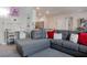 Cozy living room with sectional sofa, work desk, and open layout for versatile living space at 4705 Blaise Ave # 101, North Las Vegas, NV 89084