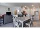 Open living space featuring a dining area with a view of the living room and kitchen at 4705 Blaise Ave # 101, North Las Vegas, NV 89084