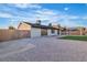 Backyard of the house with rock landscaping and block fencing at 528 Sheffield Dr, Henderson, NV 89014