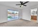 Bedroom with neutral carpet and glass sliding doors to backyard at 528 Sheffield Dr, Henderson, NV 89014