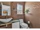 Elegant half bathroom showcasing mosaic tiling, modern vanity, and sleek fixtures at 556 Caribbean Palm Dr, Las Vegas, NV 89138