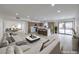 Bright and airy living room flows into modern kitchen with island and stainless steel appliances at 6 Megan Dr, Henderson, NV 89074