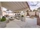 Comfortable covered patio includes sleek furniture and desert landscaping, great for entertaining at 6 Megan Dr, Henderson, NV 89074