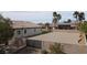 Expansive backyard featuring mature palm trees and a large gated area at 6392 Ebony Legends Ave, Las Vegas, NV 89131