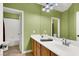 Bright bathroom features a double sink vanity and a separate tub and shower at 6392 Ebony Legends Ave, Las Vegas, NV 89131