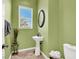 Powder room featuring a pedestal sink and a toilet with a neutral color scheme at 6392 Ebony Legends Ave, Las Vegas, NV 89131