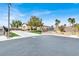 Charming single-story home with well-manicured front lawn and a long driveway at 6392 Ebony Legends Ave, Las Vegas, NV 89131