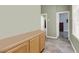 Hallway with cabinets and doorways leading to other rooms in the house at 6392 Ebony Legends Ave, Las Vegas, NV 89131