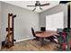 Spacious home office with wood floors, two work stations, and a ceiling fan at 6392 Ebony Legends Ave, Las Vegas, NV 89131