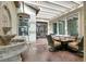 Inviting covered patio with elegant seating and a tranquil water fountain feature at 6392 Ebony Legends Ave, Las Vegas, NV 89131